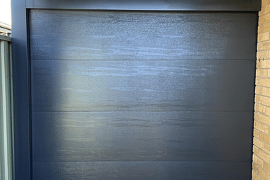 Sectional Garage Door Black On Brick